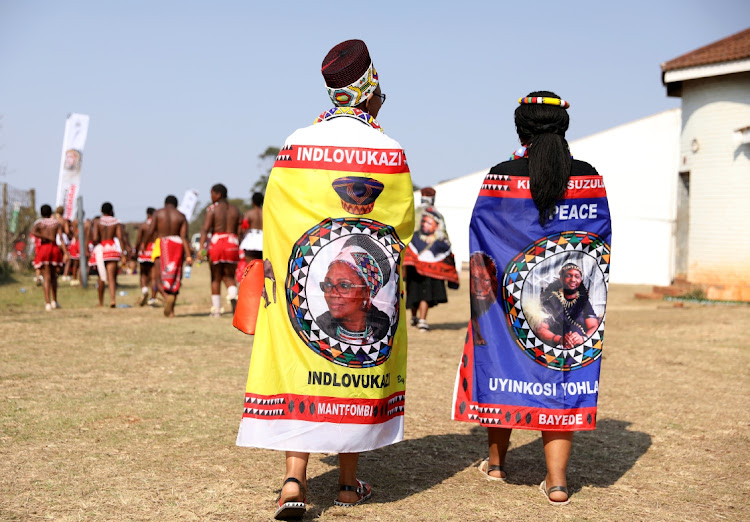 Members of the royal family wear a scarf bearing an image of the late Queen Mantfombi Dlamini and another wearing a scarf bearing an image of King Misuzulu kaZwelithini.