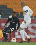 Thabiso Kutumela of Orlando Pirates and Robyn Johannes of Cape Town City during the Absa Premiership match at FNB Stadium on September 19, 2017 in Johannesburg, South Africa. 