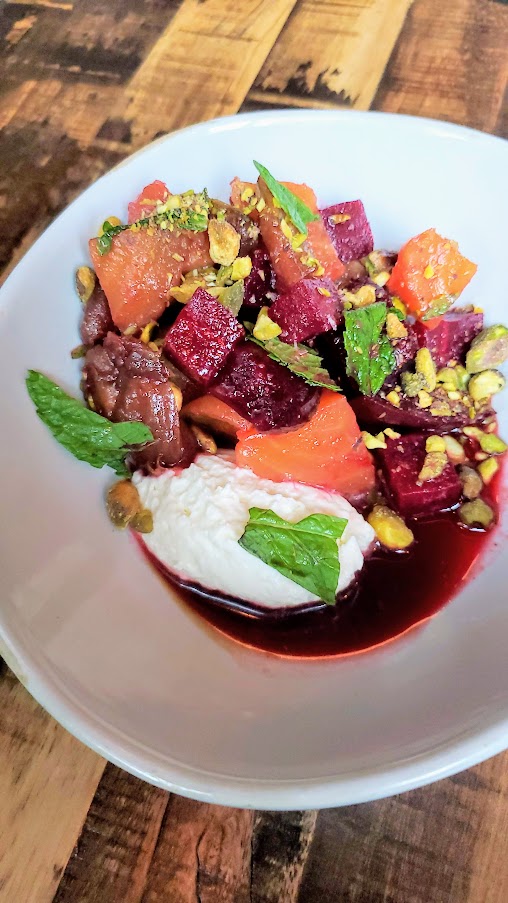 Smoked Beets with Sheep's Milk Mousse, Pickled Dates, Pistachios, Pomegranate Molasses, Mint available at dinner and happy hour at Normandie PDX