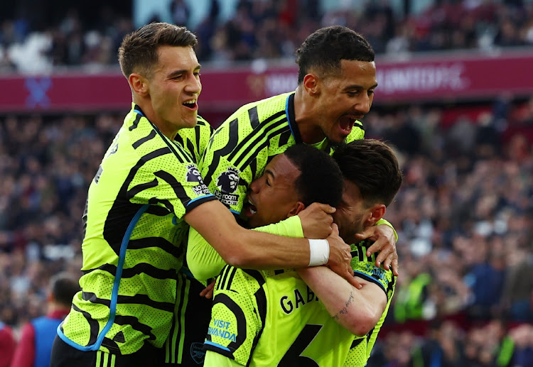 Arsenal's Gabriel celebrates scoring their third goal with Jakub Kiwior, William Saliba and Declan Rice against West Ham at London Stadium in London, Britain, February 11 2024. Picture: PAUL CHILDS/ACTION IMAGES/REUTERS