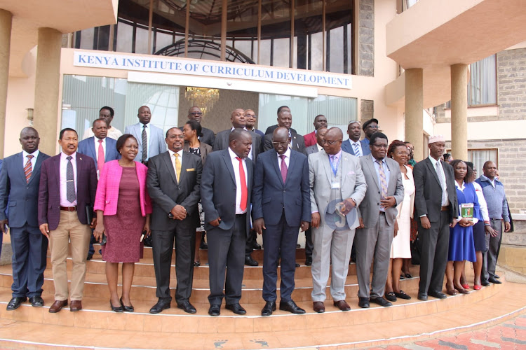 Basic Education Principal Secretary Belio Kipsang poses for group photo with directors and other officials during the stakeholders engagement on senior school and teacher education at KICD, Nairobi on April 3, 2024/LEAH MUKANGAI