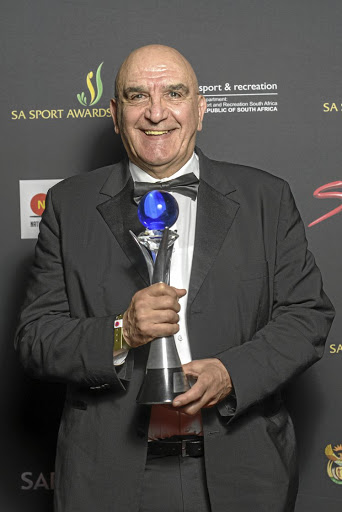 Boxing referee and judge Stanley Christodoulou displays his trophy after being honoured with a lifetime achievement award. / Frikkie Kapp / Gallo Images