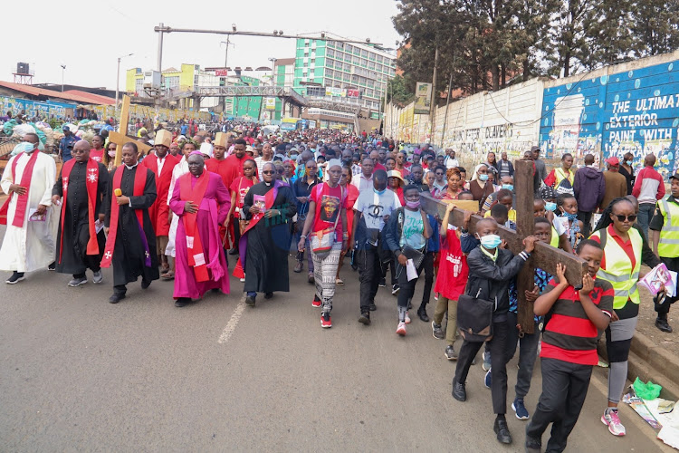 Catholic faithful walking all the way the to Westlands and back as the way to imitate and commemorate Jesus Christ's suffering while carrying the cross.