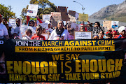 About 300 people from towns around the Western Cape marched in Cape Town to hand over a memorandum to Parliament demanding more police to curb gang violence in their areas on October 3 2018