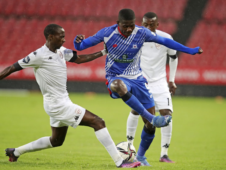 Tawanda Macheke of Maritzburg United challenged by Nyiko Mobbie of Sekhukhune United.