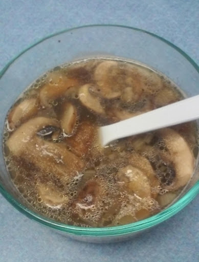 Saute mushrooms and shallots with barley, in a mushroom broth