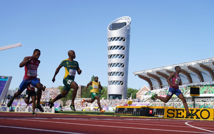 Erriyon Knighton of the US crosses the line to win his heat ahead of Luxolo Adams.