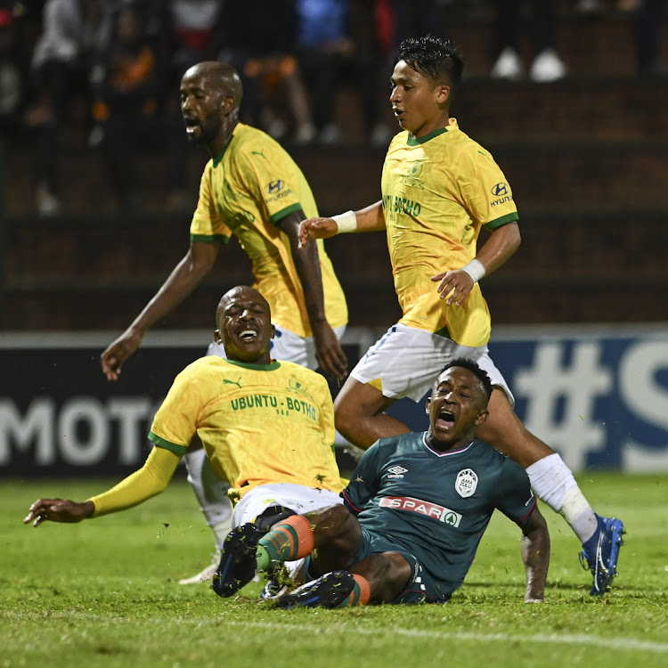 AmaZulu's Pule Ekstein is challenged by Khuliso Mudau of Mamelodi Sundowns in the DStv Premiership match at King Zwelithini Stadium in Umlazi, Durban on Wednesday night.