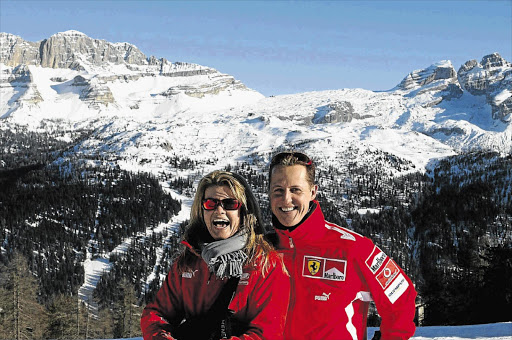 CAREFREE: Corinna and Michael Schumacher on a skiing trip before his accident in France