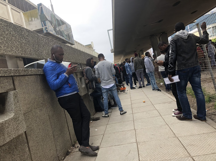 Queues at the Department of Home Affairs on the Foreshore. A new refugee office is to be opened in Maitland.