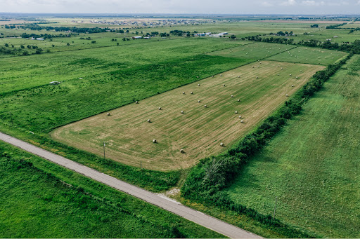 Buy this luxury property in Waller (United States) - agricultural fields with round hay bales