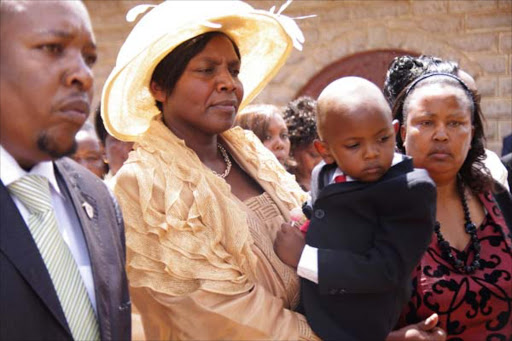 TAKING SIDES: Karume’s widow Grace and son Emanuel Karume during the burial of her husband Njenga Karume at his Cianda home, Kiambu county, on March 3, 2012. Photo/Njenga Gicheha