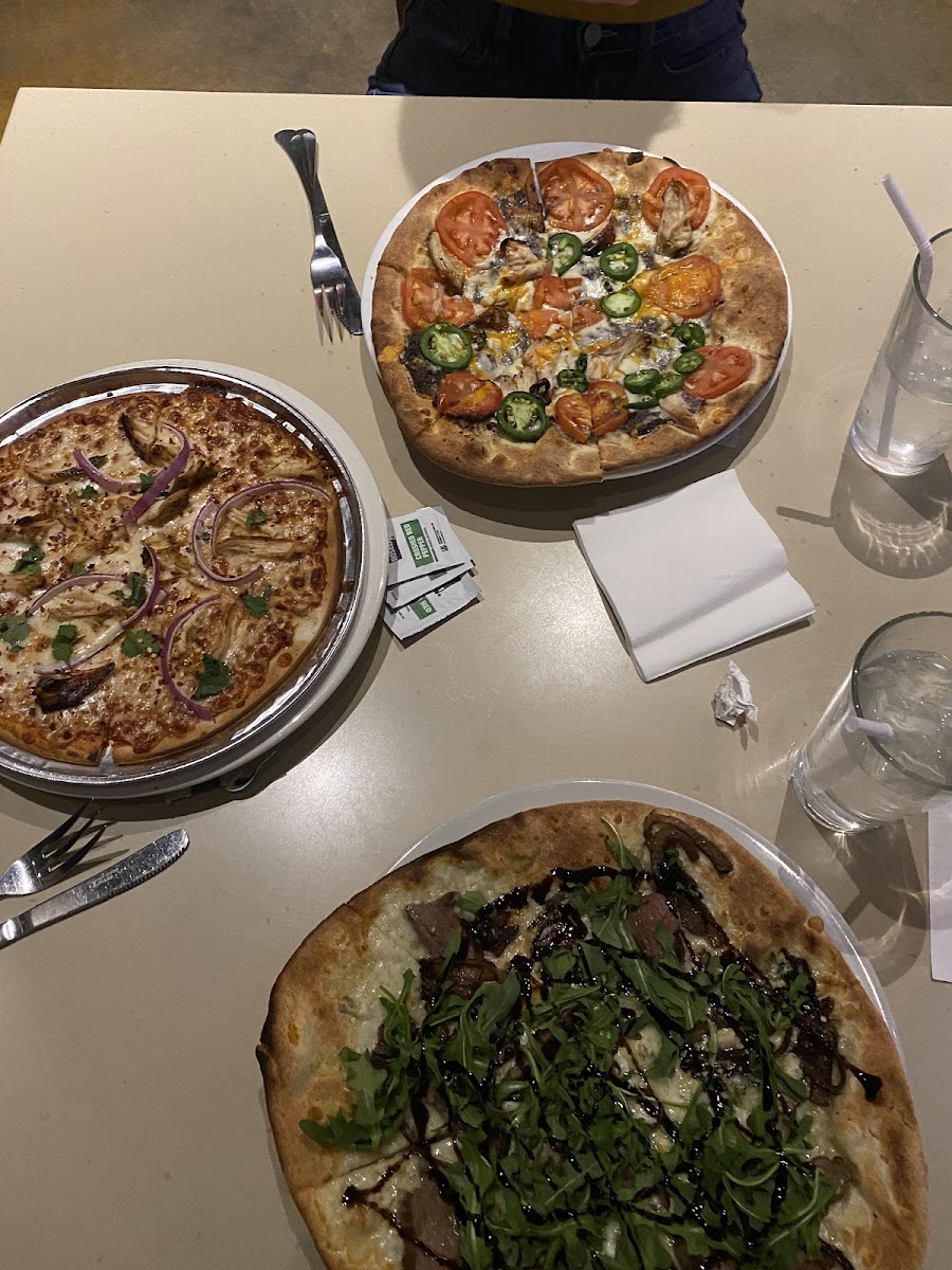 GF pizza (left) has its own tin that it’s baked on