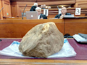 The rock used to kill Hannah Cornelius, displayed in the high court in Cape Town during the murder trial of four defendants on October 16 2018