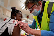 A child receives a dose of the Pfizer-BioNTech coronavirus disease (COVID-19) vaccine at Smoketown Family Wellness Center in Louisville, Kentucky, U.S., November 8, 2021. 