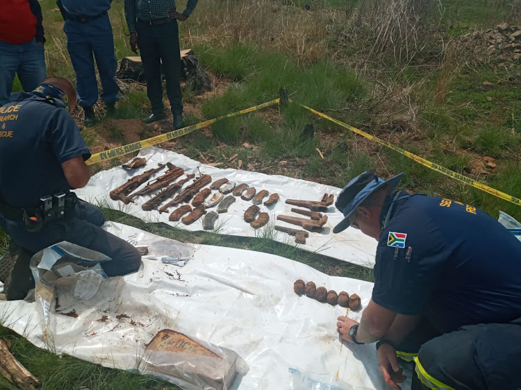 Rifles, ammunition and hand grenades were found.