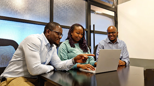 Washington Ogol, CEO of Statsspeak Group (L), and Caine Wanjau, CEO and co-founder of Namiri Technology Limited, onboarding a DigiTax customer to e-TIMS.