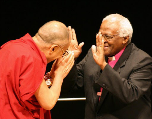 Archbishop Emeritsus Desmond Tutu (R) of South Africa welcomes exiled Tibetan spritual leader Dalai Lama prior to the international peace conference in Hiroshima, 02 November 2006. Nobel laureates, including Tutu, are urging China to hold talks with the Dalai Lama in light of recent Tibetan self-immolations to understand Tibetans' grievances and find a non-violent solution.