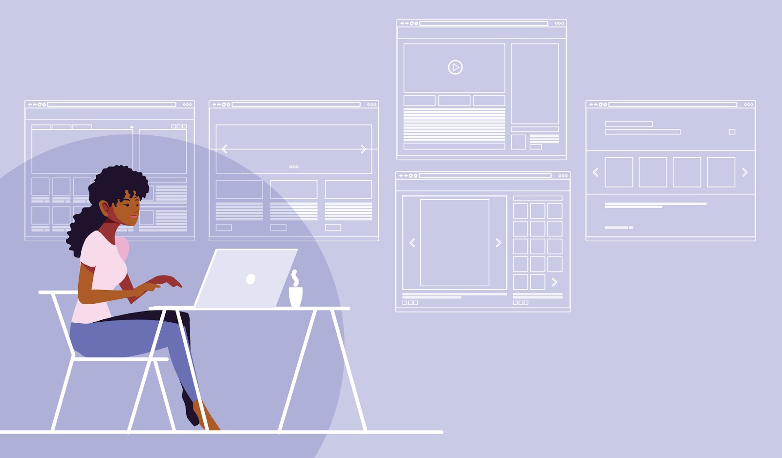A designer working at a desk and laptop creating website layouts