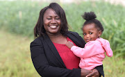 Mildreat Muroyiwa, pictured with her 22-month-old daughter Imani, who will be accompanying her to Friday's graduation ceremony. 