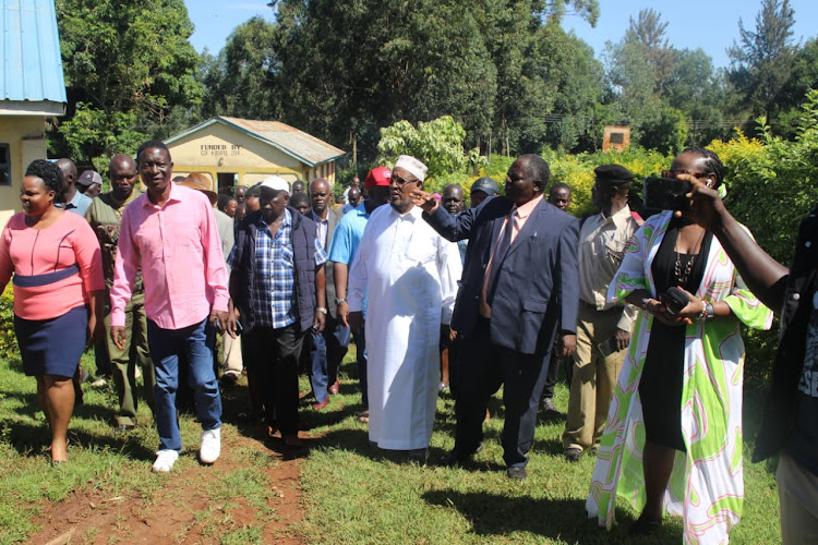 Members of the Cohesion Committee led by chairman Yussuf Haji (in a gown) shown around Wire Special school during their tour of the institution