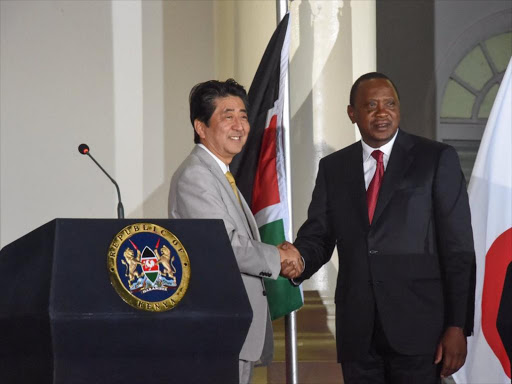 President Uhuru Kenyatta with Japan PM Shinzō Abe during a joint press conference after bilateral discussions. /PSCU