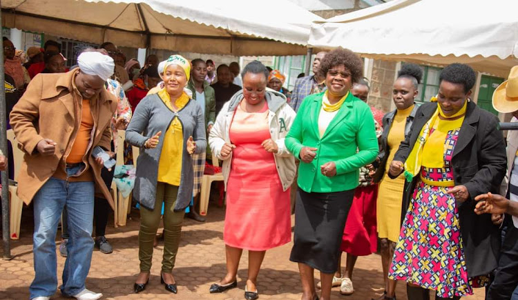 Kandara MP Alice Wahome dancing with her constituents at Kandara NGCDF offices on July 15