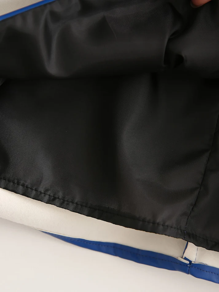 Falda de cuero PU azul real anudada a la cadera. Elegante y moderna, perfecta para un look audaz y sofisticado. Destaca tu figura con estilo.