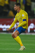 Cristiano Ronaldo of Al Nassr makes an obscene gesture after scoring their first in the Saudi Pro League match against Al Shabab at Al Shabab Club Stadium in Riyadh on Sunday. 