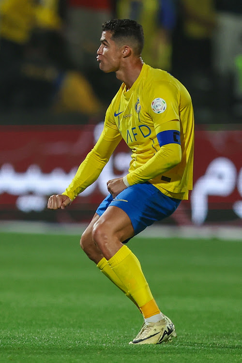 Cristiano Ronaldo of Al Nassr makes an obscene gesture after scoring their first in the Saudi Pro League match against Al Shabab at Al Shabab Club Stadium in Riyadh on Sunday.