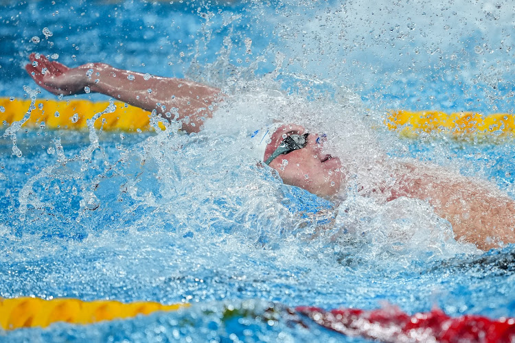 Pieter Coetzé in action in the men's 100m backstroke final in Doha.