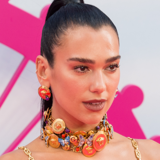 Dua Lipa gives us doll eyes.