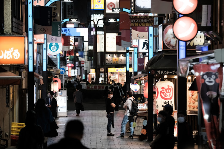 Pedestrians walk past restaurants at night in the Shinjuku district of Tokyo, Japan. Picture:SOICHIRO KORIYAMA/BLOOMBERG