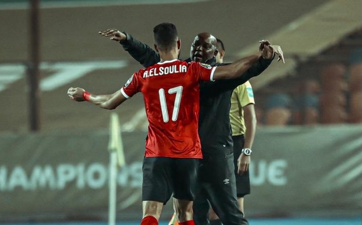 Amr El Soleya embraces Al Ahly coach Pitso Mosimane after scoring his team's opening goal in their 2-1 Caf Champions League final victory against Zamalek at Cairo International Stadium on Friday night.