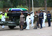 Winnie Madikizela-Mandela's coffin is given a military escort into Fourways Memorial Park where she was buried on April 14 2018.