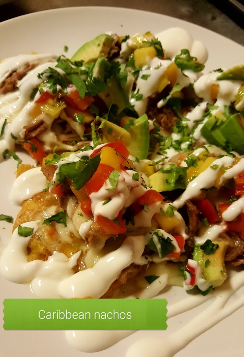 plantain chips topped w/choice of meat or vegan option... drizzled with sour cream, avocado and mango pico de gallo