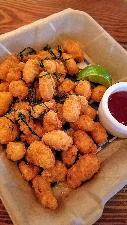 Shipwreck PDX Tom Yum Popcorn Shrimp with fried kaffir lime leaves and Lingham's Original Hot Sauce