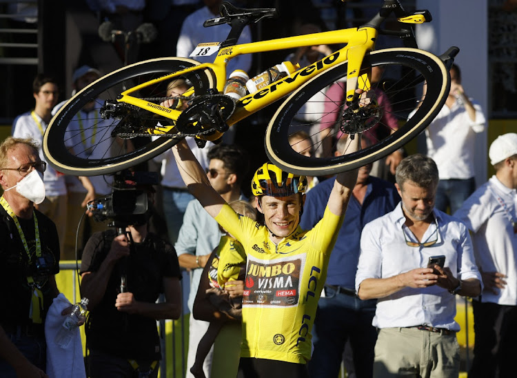 Jumbo-Visma’s Jonas Vingegaard wearing the overall leader’s yellow jersey celebrates winning the final stage of the Tour de France, in Paris, July 24 2022. Picture: CHRISTIAN HARTMANN/REUTERS