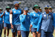 SA limited-overs captain Quinton de Kock and bowlingn coach Charl Langeveldt leads the team out for a training session at the Wanderers in Johannesburg on February 19 2020 before the Covid-19 disruptions. 