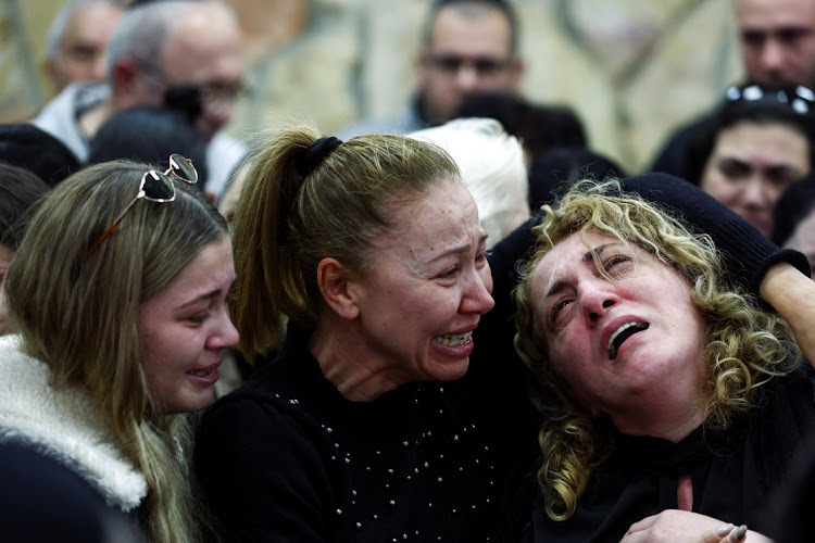 Friends and family mourn at the funeral of Rafael Ben Eliyahu who was killed on Friday in a shooting attack in a synagogue by a Palestinian gunman on the outskirts of Jerusalem, at a cemetery in Jerusalem, January 29 2023. Picture: RONEN ZVULUN/REUTERS