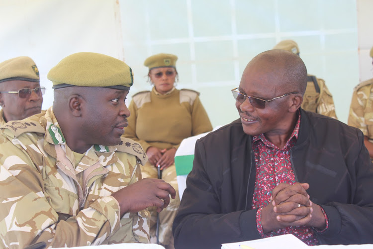 KWS senior assistant director in charge of the mountain conservation area George Nagwala and Wildlife CAS John Chelimo during the launch of tree planting in Aberdare National Park on Friday