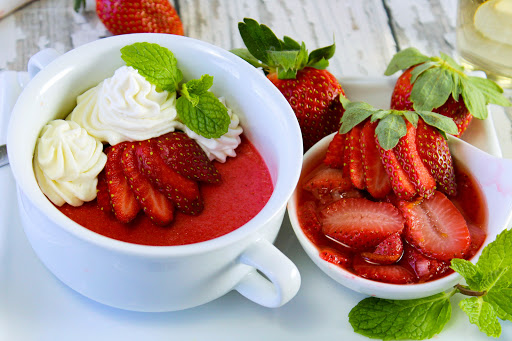 Red velvet pots de creme with champagne soaked strawberries.