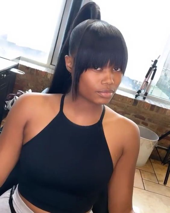 lady rocking high ponytail with bangs