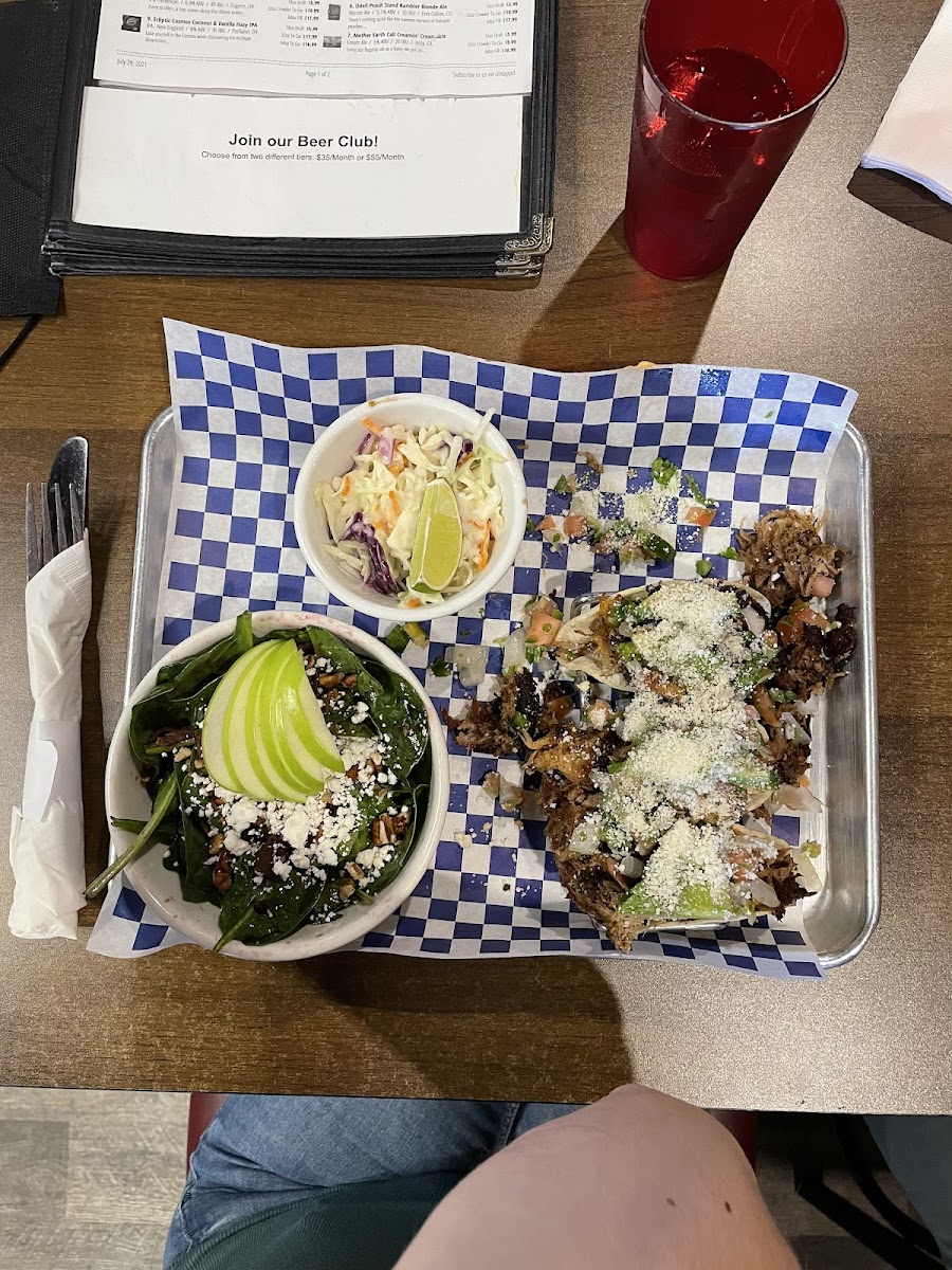 Pork tacos, coleslaw, and baby spinach salad