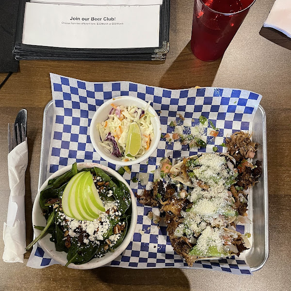 Pork tacos, coleslaw, and baby spinach salad