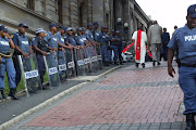 A priest walks into the Durban High Court for a prayer with Jacob Zuma.