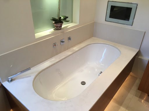 Sunk in bath and  TV in the wall 
