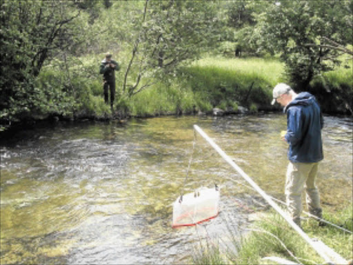 ALWAYS FUN: Taking water samples for analysis.