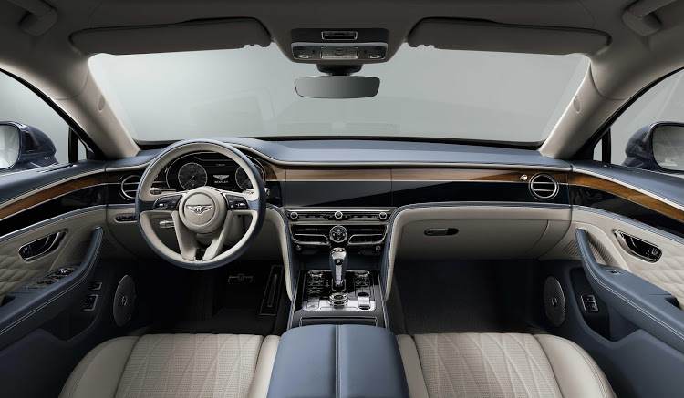 The lap of luxury includes a veneer section in the dashboard that rotates to reveal a touchscreen.