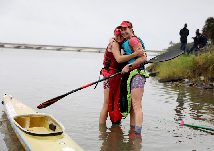 Abby Solms and Jessica Behn celebrate after winning the 2024 Dusi Canoe Marathon women's race. Picture: SANDILE NDLOVU